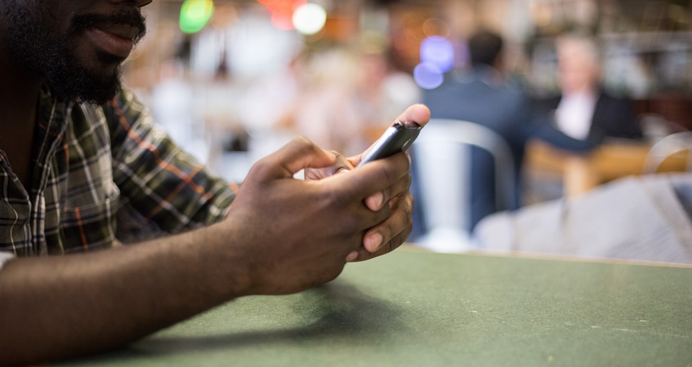 Close up view of man on his phone